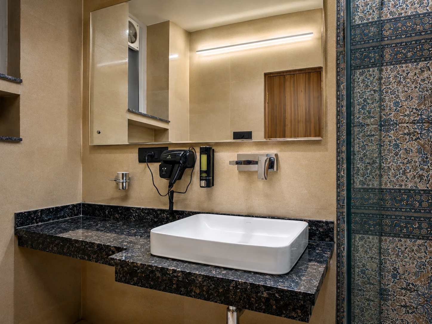 Deep-cleaned disinfected spacious washroom layout in our Dehradun long-stay suite